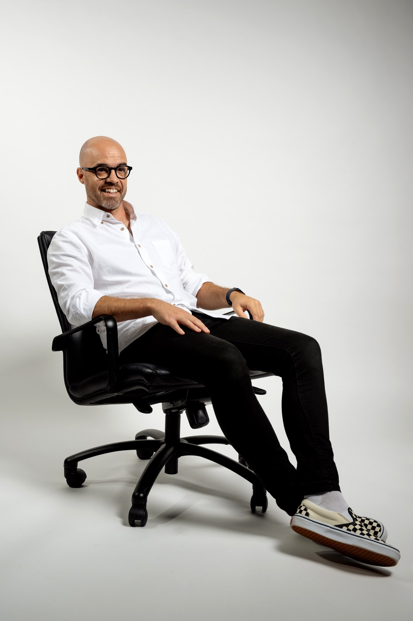 Reagan White seated relaxed Auckland creative services